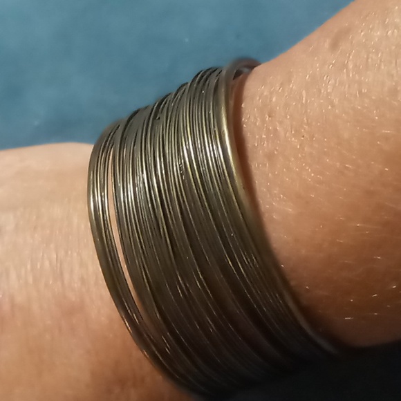 2 cuff bracelets one copper tone feather shaped one a brassy wire wrapped - Picture 4 of 4